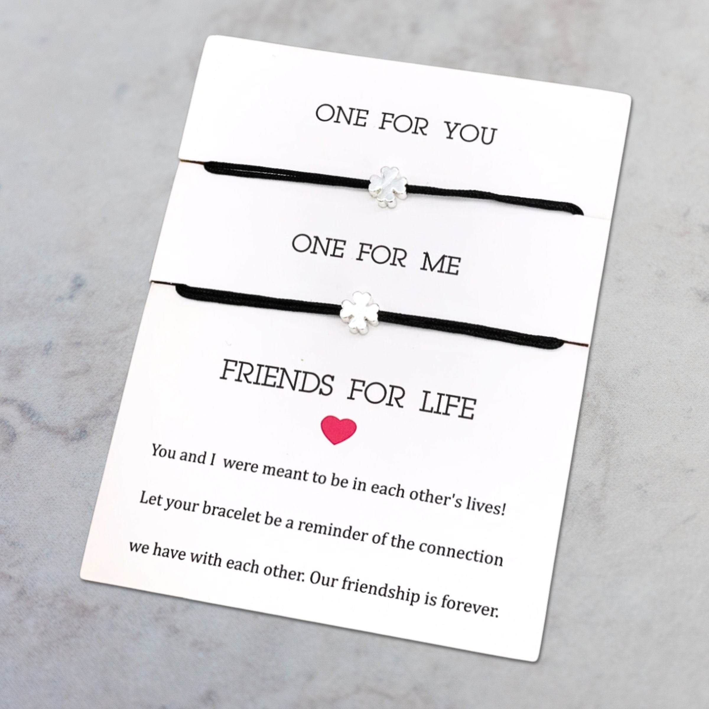 Armband_Friendsforlife_Kleeblatt_schwarz_silber. 2 Armbänder auf Karte gezogen. Marke: Parsley&Pepper